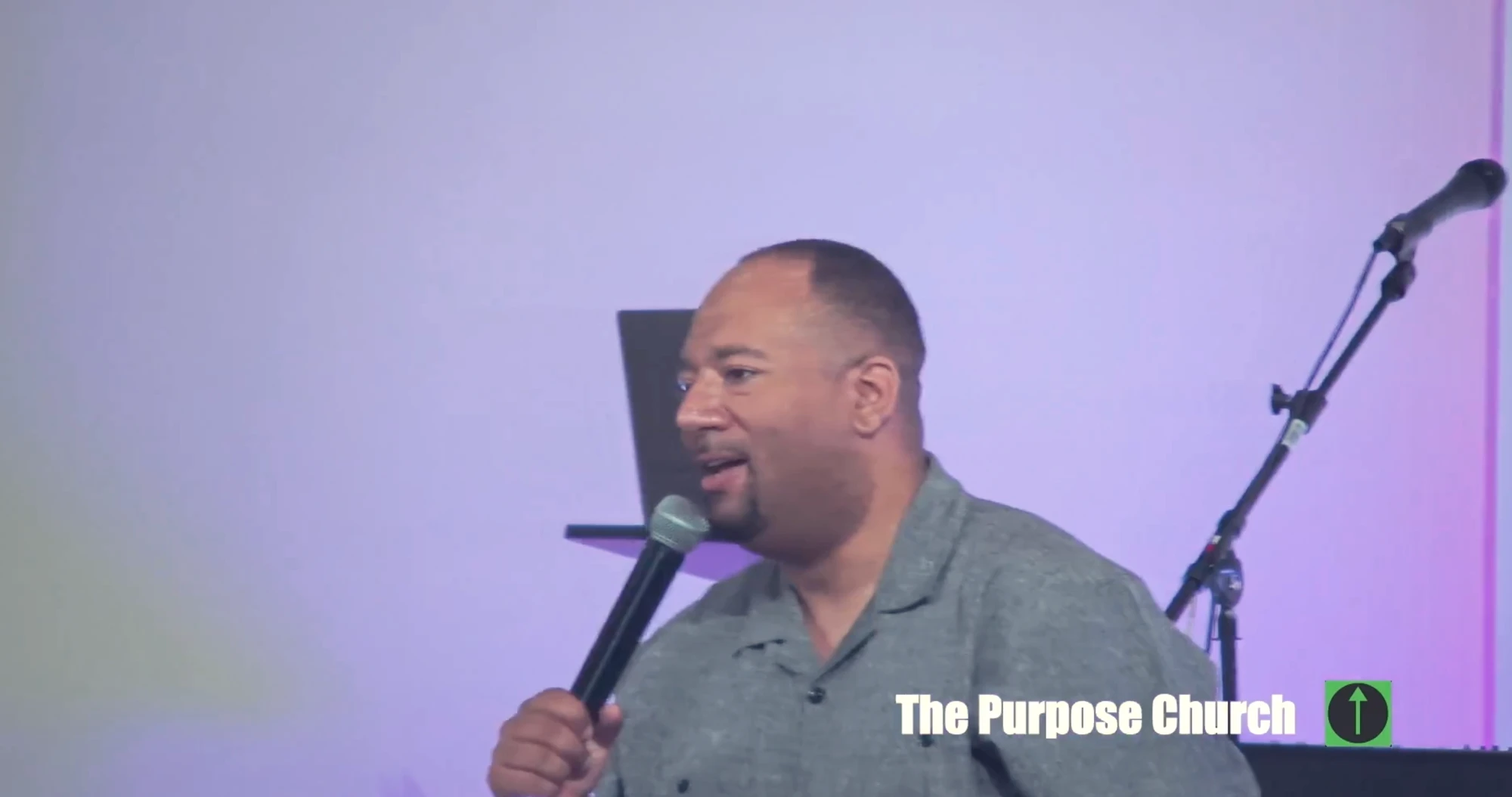 A man speaking to the congregation on a Sunday at The Purpose Church in Kent, WA